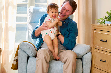 Image of Suzy Electronic Recliner and Swivel Glider | USB Charging Port, and Dad and baby