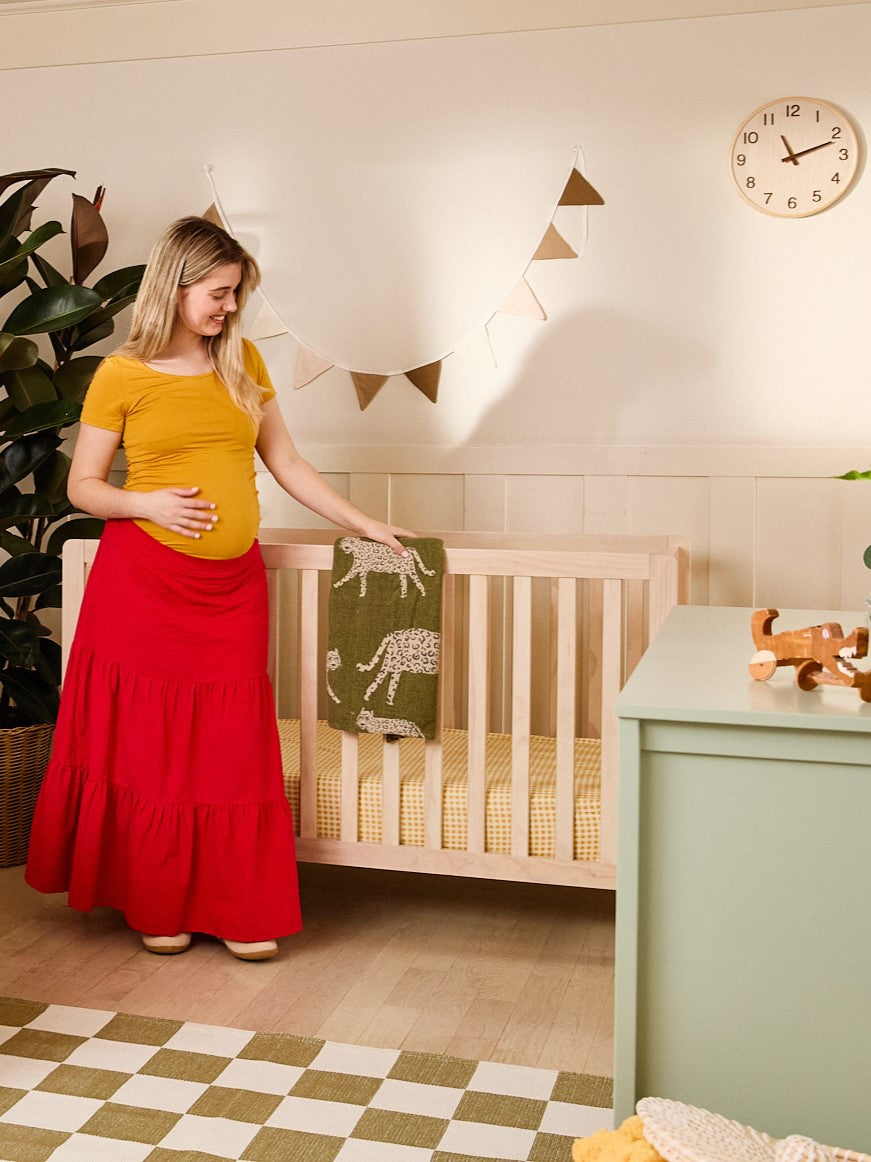Image of Pregnant woman with 
Colby 4-in-1 Low-Profile Convertible Crib