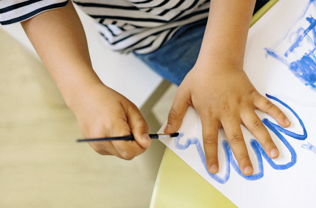 Image of child hand, drawing