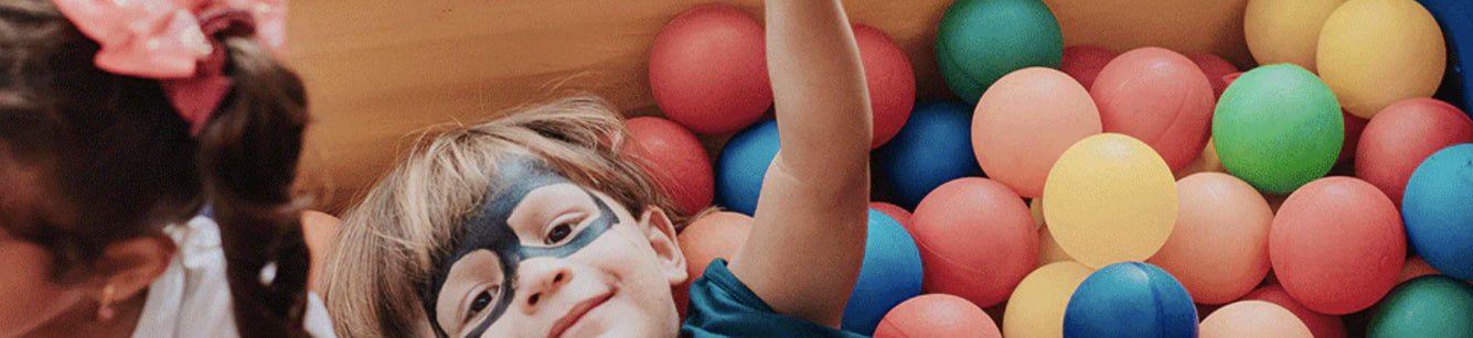 Image of kid in a ball pit